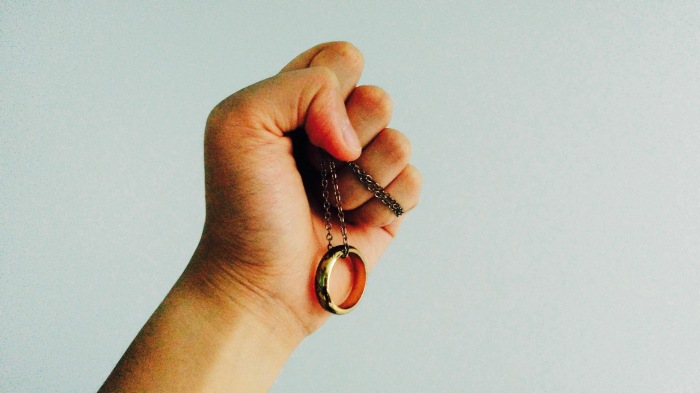 fist-holding-the-one-ring-necklace